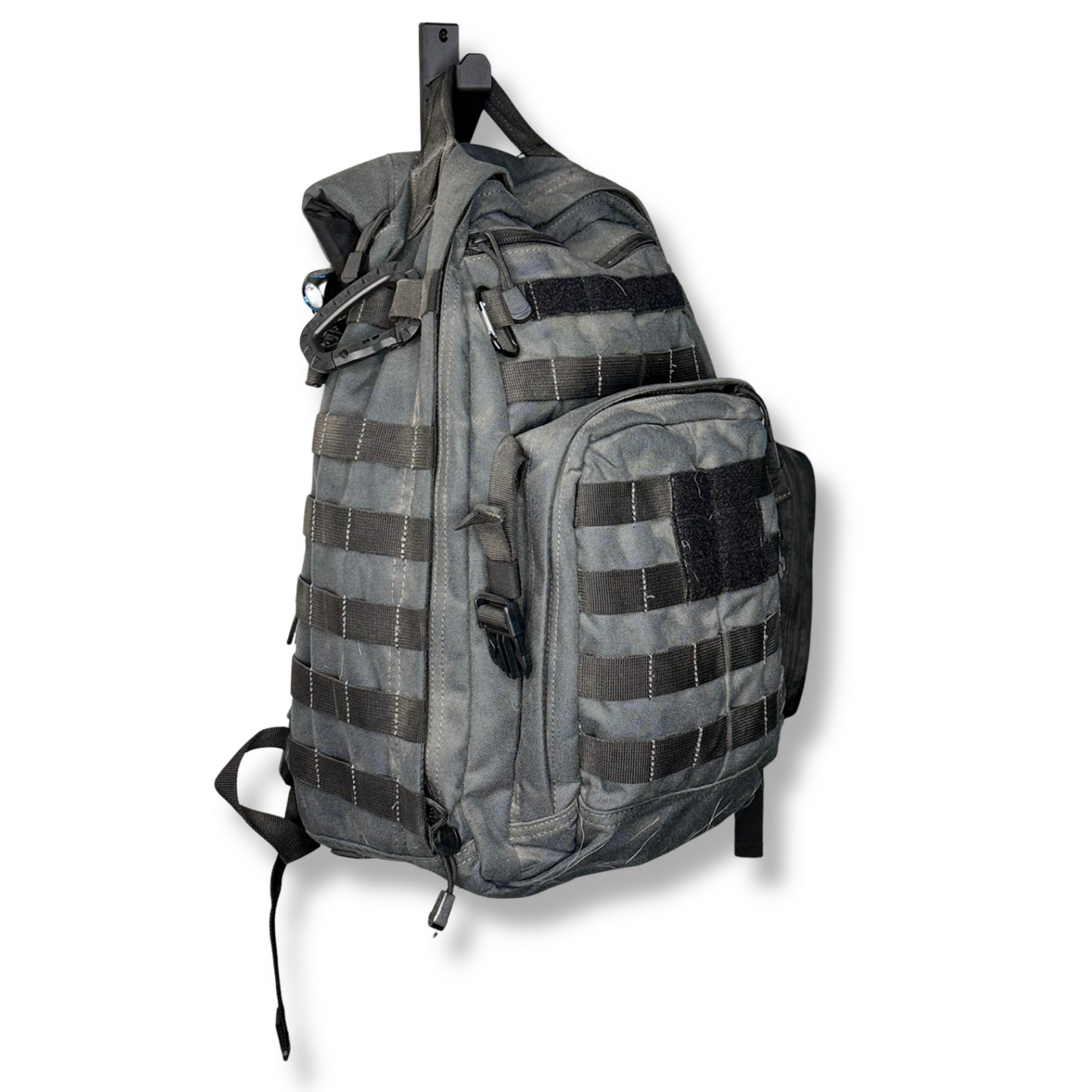 Gray tactical sling bag with multiple straps on a white background WAYMKR GO BAG MOUNT
